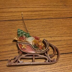 Festive Sleigh Ornament with Green and Brown Accents